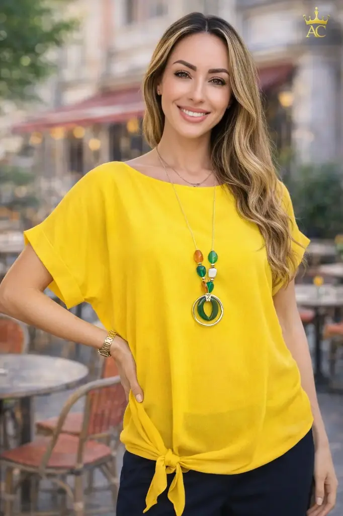 Blouse Qwynn ample manches courtes encolure ronde boutons au bas de la blouse